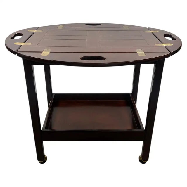 This charming vintage rolling cart from The Bombay Company captures the classic English butler's tray tradition in a...