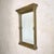 A large, mid-20th-century Italian brass wall mirror shaped with architectural grandeur. Standing at 45.5 inches tall, the...