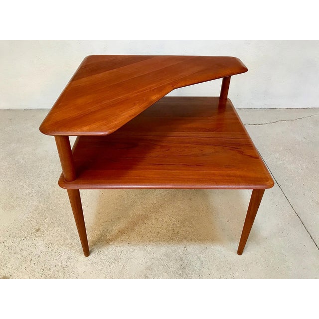 - Mid-century Minerva side table - Manufactured in the 1960s - Made of solid teak wood This piece has an attribution mark,...