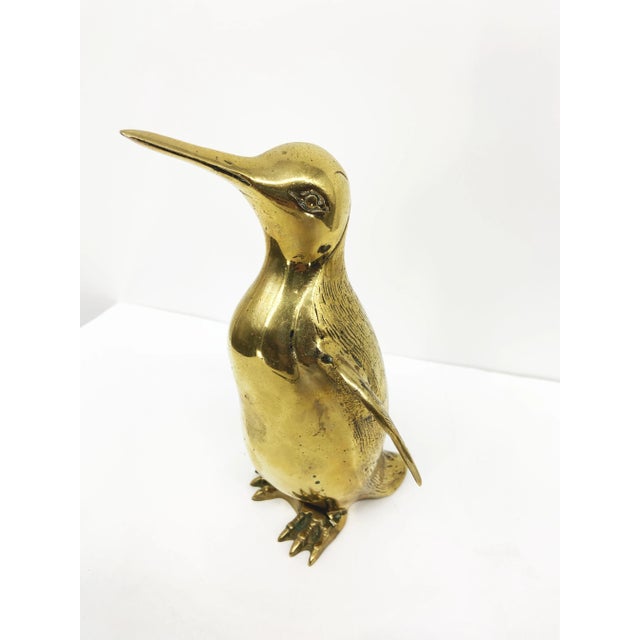 The Vintage Brass Penguin Figurine is a charming and collectible decorative item, measuring 8 inches in height. Crafted...