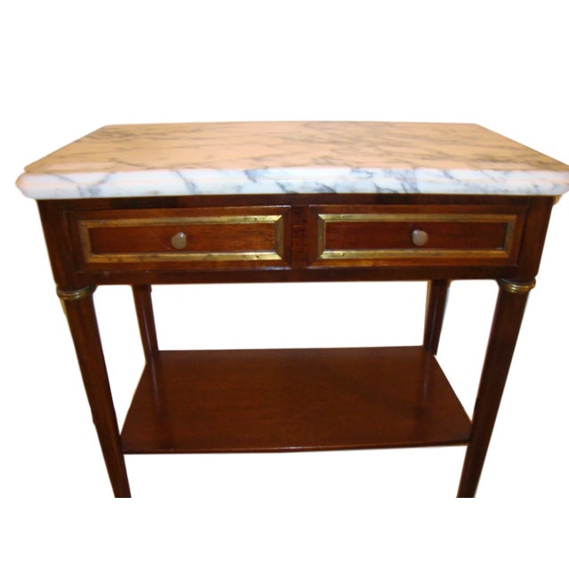 A Diminutive mahogany chest/stand with a marble top. This piece has two drawers, and a single shelf below. Drawer depth -...