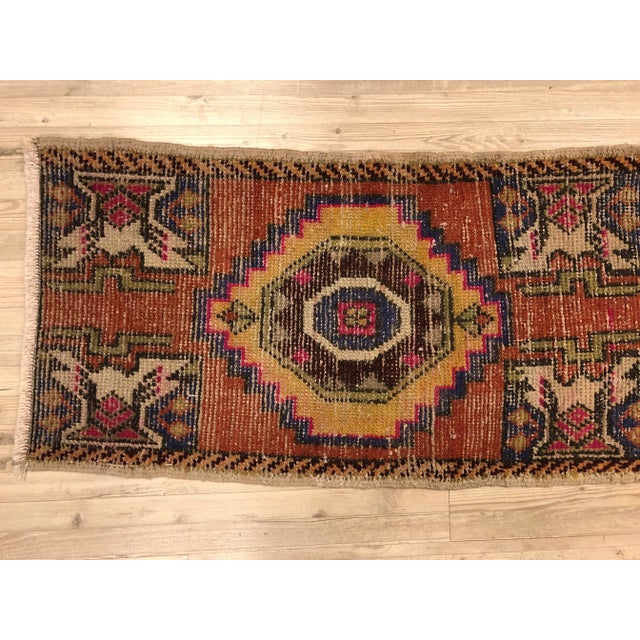 This is a vintage Turkish Anatolian kilim rug from the 1960s. The piece was hand-woven.