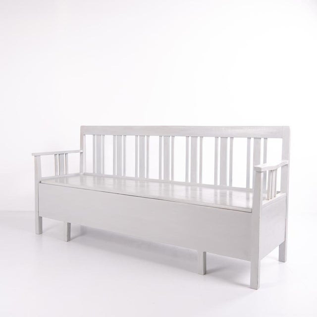 Swedish bench from the 1860s, made in pine and later painted in grey. A classic Scandinavian piece with decorative painted...
