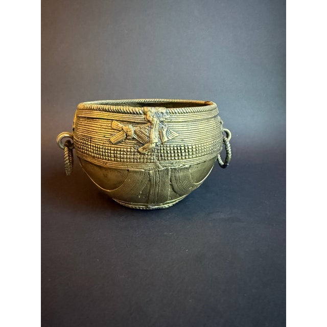 Tribal Indian Brass Dhokra bowl, likely made with the ancient lost wax casting technique. The casting technique creates...