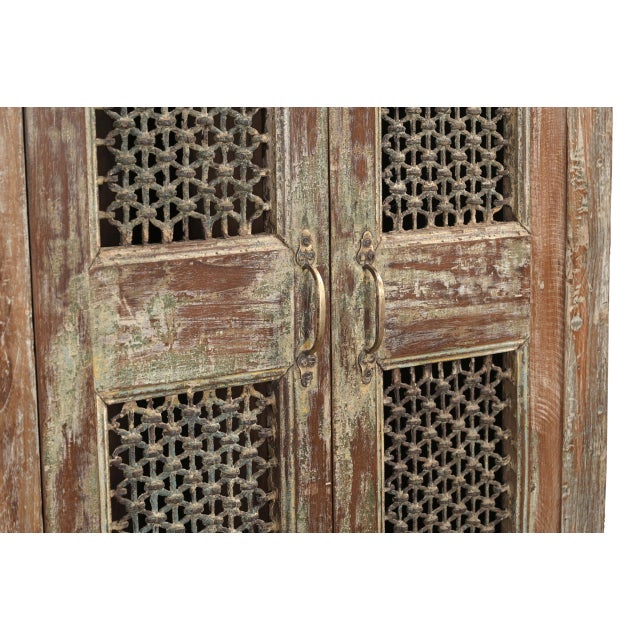 Indian Teakwood Cabinet constructed from Antique Doors with inset Jali Iron, and the case built in reclaimed teak. The...