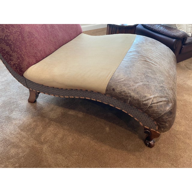 Traditional oversized Chaise Lounge. A beautiful combination of Upholstered fabrics and Leather with carved legs,...