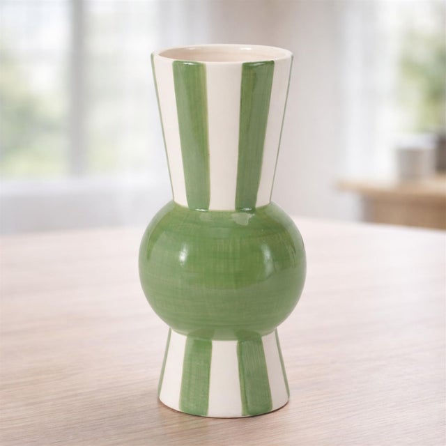 Add a cheerful pop of pattern to your decor with this Striped Accent Vase. Featuring a playful silhouette with a rounded...