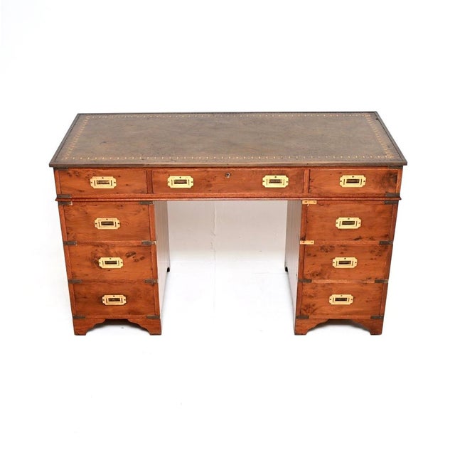 A top quality antique yew wood military campaign style pedestal desk. This was made in England, it dates from around the...
