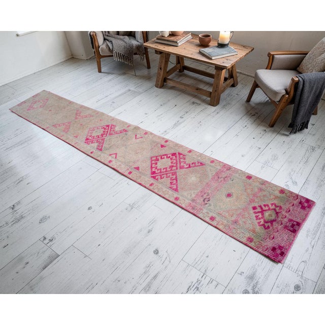 This masterfully hand-knotted runner originates from the high plateaus of Eastern Anatolia, dating to the 1970s. It...