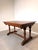 ring timeless craftsmanship into your home with this beautiful antique solid oak draw-leaf dining table. Featuring richly...