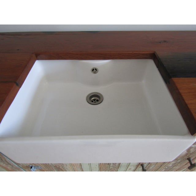 An unusual kitchen base and matching top units made from reclaimed pine bead board from the 1900s. The counter tops made...