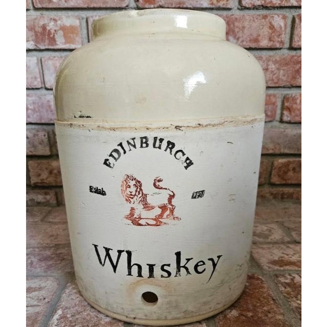 his marevelous antique Corona Stoneware crock was created for Edinburgh Scottish Whiskey with a Brisol tan and white salt...