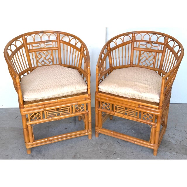 Pair of Brighton Pavilion Revival Bamboo, Rattan and Caned Armchairs, Circa 1970s Inspired by the celebrated Anglo-Chinese...