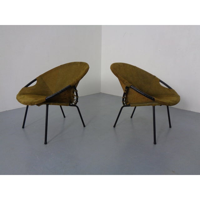 Two balloon leather chairs with metal frames, produced by Lusch in Germany. I have official proof of authenticity such as...