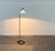 Rare mid-century floor lamp from Denmark from the 60s. A minimalist design with a special foot. The contrast between the...