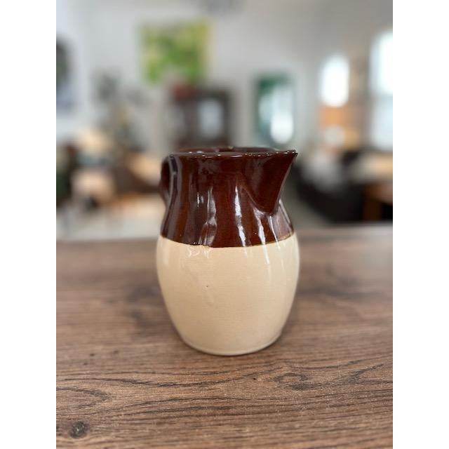 RRP Co. (Robinson Ransbottom Pottery Co.), based in Roseville, Ohio, USA. Features a two-tone design with a glossy dark...
