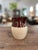 RRP Co. (Robinson Ransbottom Pottery Co.), based in Roseville, Ohio, USA. Features a two-tone design with a glossy dark...