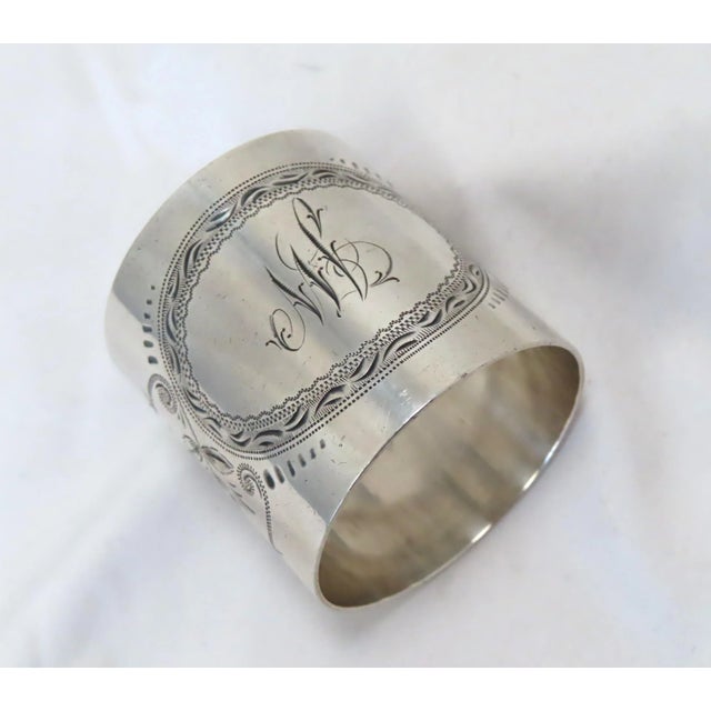 This is a Great Looking oversize antique American Sterling Silver Napkin Ring. It has very fine hand engraved Floral Sprig...