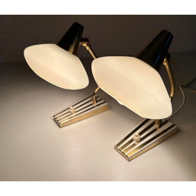 Pair of rare vintage bedside table lamps, brass base with white pinstripes trim, brass stem and cap, opaline glass shades...