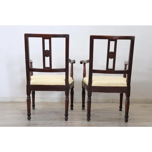 Lovely Italian antique armchairs, set of 2, 1750. These armchairs are of the period Louis XVI in solid walnut wood. The...