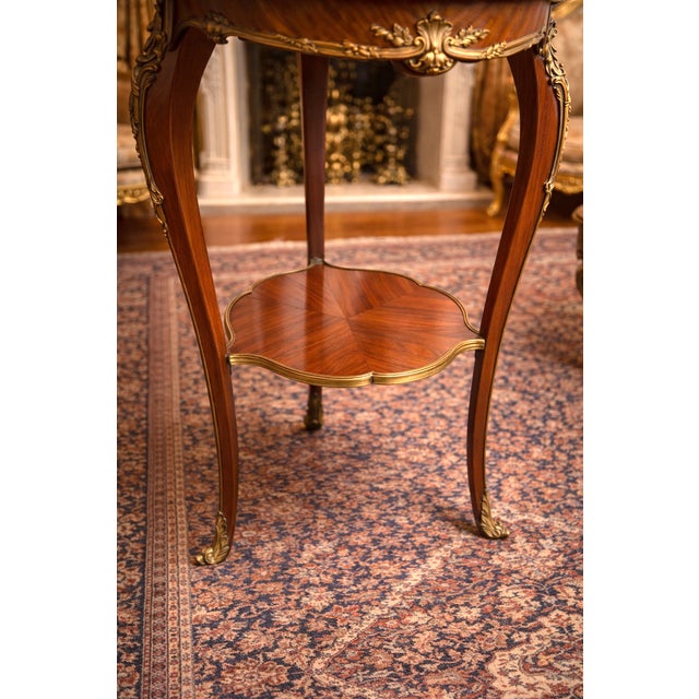 A refined 19th-century French Louis XVI-style side table, dating to approximately 1840–1860. This elegant antique table...