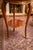 A refined 19th-century French Louis XVI-style side table, dating to approximately 1840–1860. This elegant antique table...