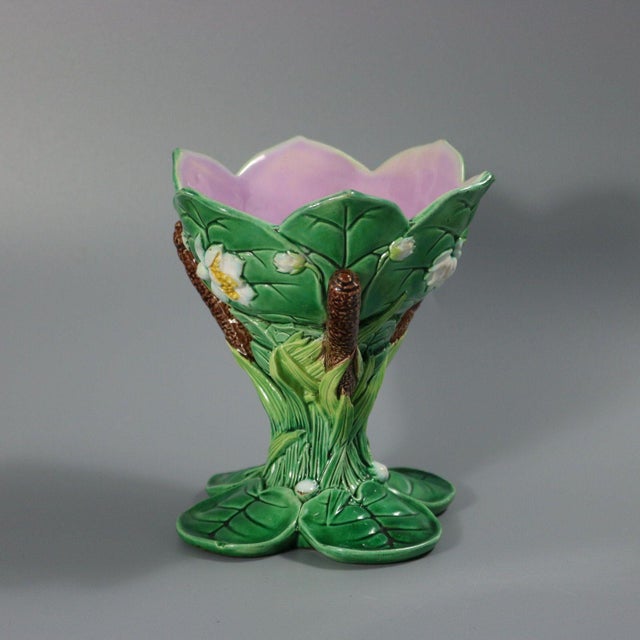 George Jones Majolica sweetmeat dish which features pond lilies and bulrushes. Pink interior version. Colouration: green,...