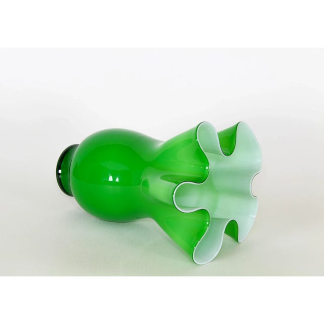 Vintage green glass ruffle vase Dimensions; 10" Width x 10" Depth x 13" Height See pictures and condition for reference If...