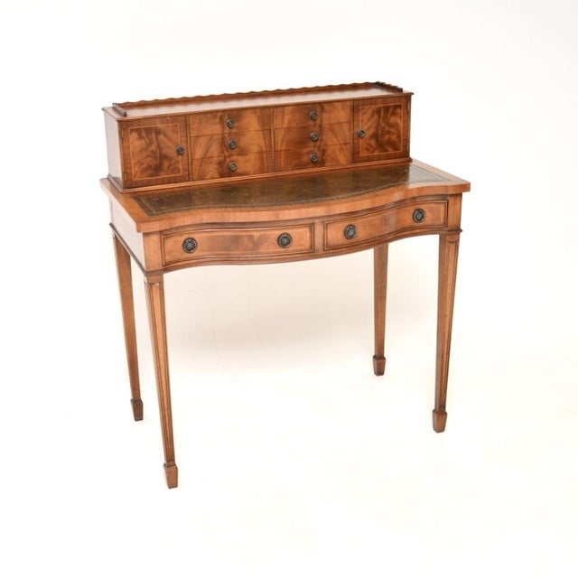 A smart and very well made antique leather top bonheur du jour writing desk. This was made in England, it dates from...