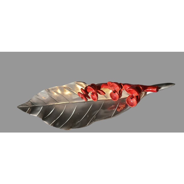 This unique decorative leaf shaped tray features a beautiful enamel red flower pattern making it a perfect addition to any...