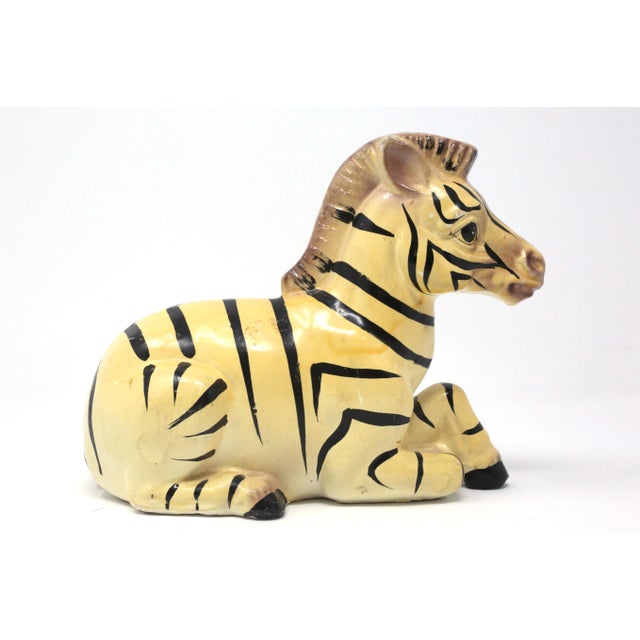 A vintage, hand-painted ceramic figure of a zebra. Stamped " Mar-Lyn / 1976." Good vintage condition; no chips or cracks.