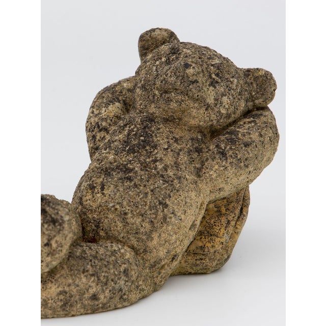 This delightful reconstituted stone teddy bear garden ornament adds a touch of whimsy and charm to your outdoor decor....