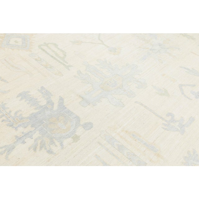 Artisanal Oushak Style Wool Area Rug: Neutral Ivory With Muted Floral Motifs For Sale In New York - Image 6 of 11