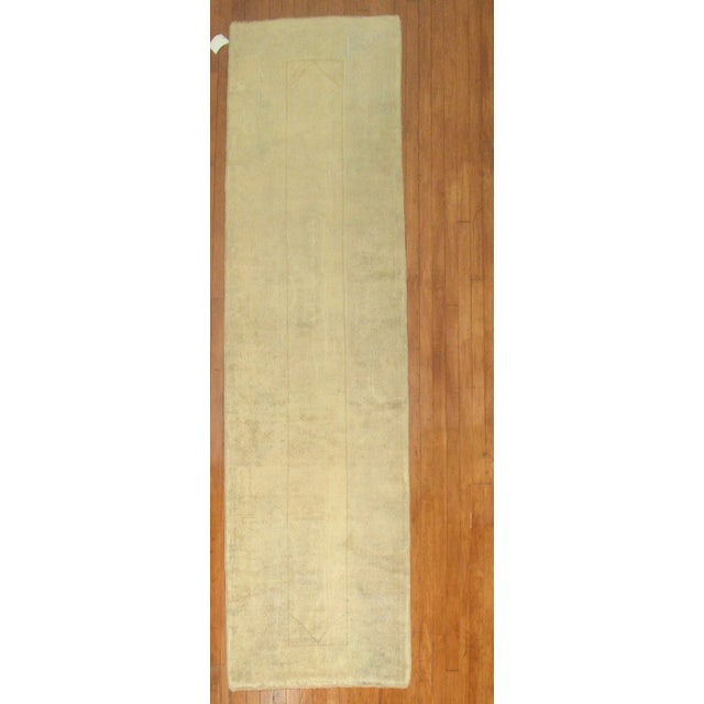 A muted, Turkish, Oushak, one of a kind runner from the middle of the 20th century