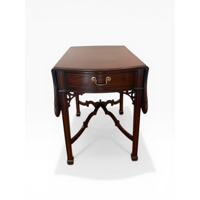 A finely crafted drop-leaf table by Kindel from their esteemed Winterthur Reproduction collection, inspired by 18th-...