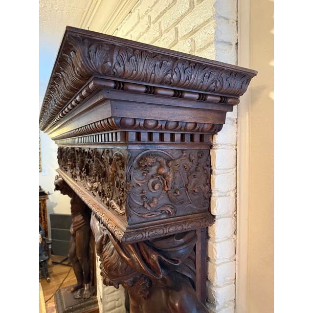 This extraordinary Neo-Renaissance walnut mantel and surround is an antique masterpiece for a large fireplace. Attributed...
