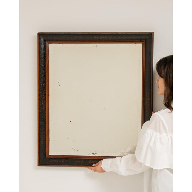 Here is a mirror, its dark bronze frame, rectangular the first thing to catch the eye. It was made in France during 19th...