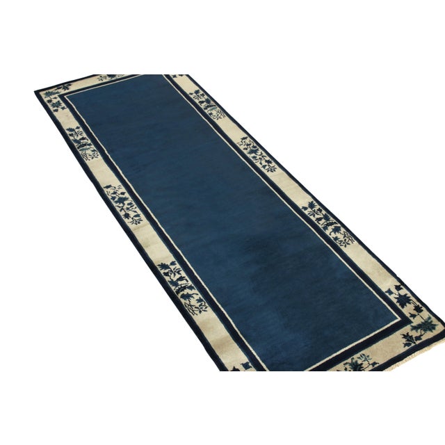 Hand-knotted in wool circa 1980–1990, this 3x12 pair of vintage Chinese Art Deco runners is a sophisticated addition to...