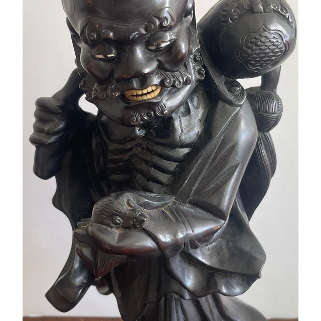 Late 19th Century 19th Chinese Carved Hardwood Figure of an Immortal Holding a Bat For Sale - Image 5 of 10