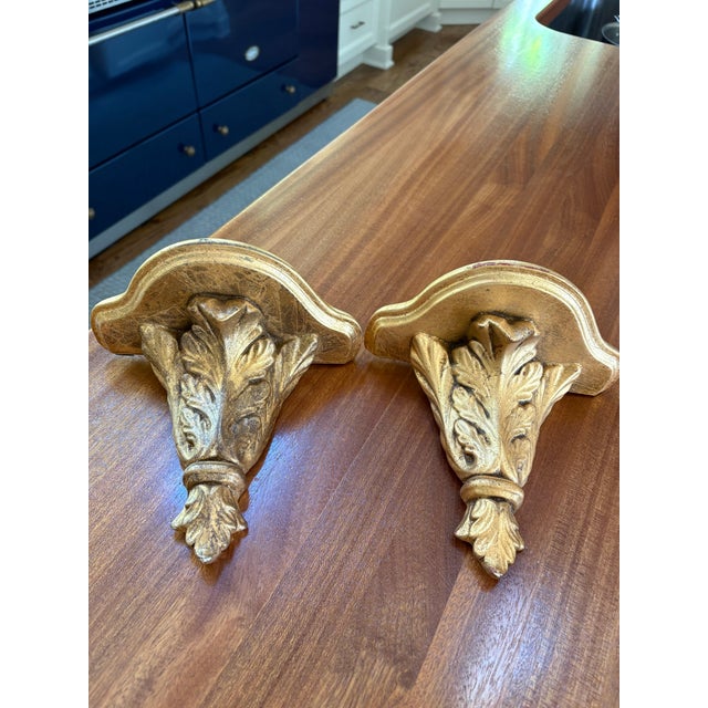 Pair of decorativegiltwood and gesso wall mounted wall brackets with ornate acanthus design