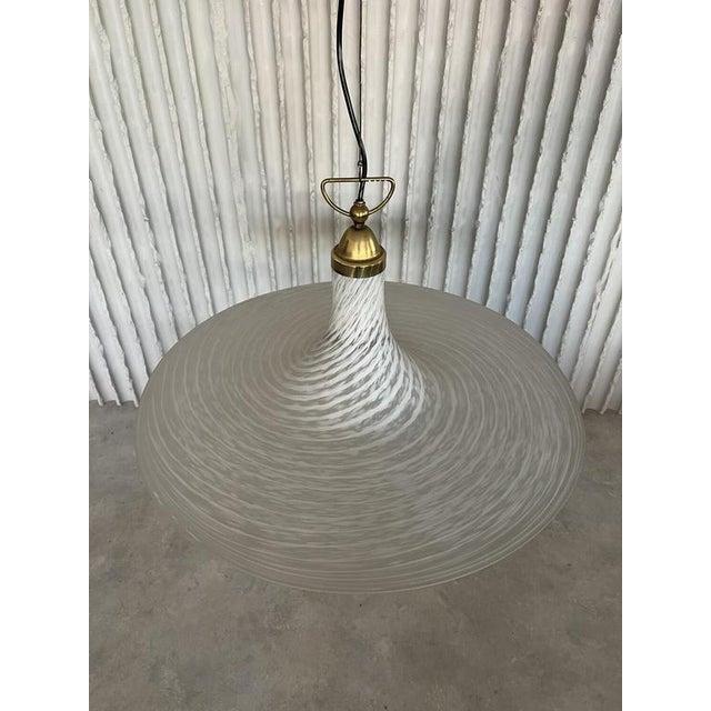 Designer unknown italy 1970s ø 67cm, h lamp 40cm h with cord 107cm a striking italian murano glass pendant light with an...