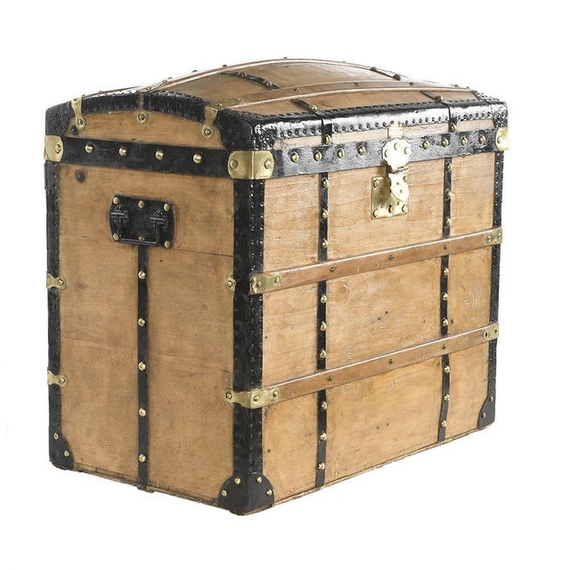 Old chest or wooden transport trunk with wood and brass reinforcements. This piece is designed in the style of the...