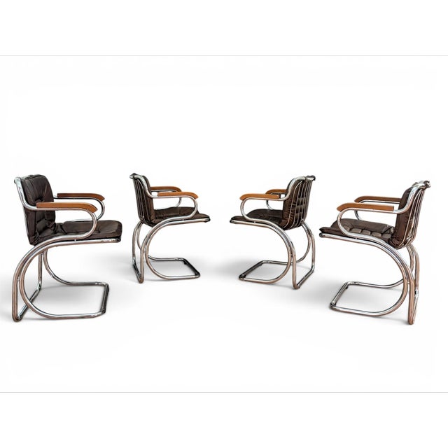 Set of 4 1970s Gastone Rinaldi cantilever chrome, wood, and dark-chocolate brown leather dining chairs. The chairs are...