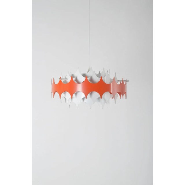 Vintage pendant lamp manufactured by the German company Doria Leuchten in the 1960s. This beautiful pendant lamp consists...