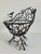 A decorative basket crafted in wrought iron with a whimsical branch-and-bird motif. Likely mid to late 20th century, this...