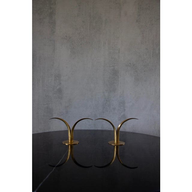 Pair of organic candlesticks/candleholders, designed by Ivar Åhlenius Björk for Ystad Metall. Made of brass and lacquered...