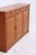 Vintage teak highboard by Dyrlund with three drawers and plenty of closed storage space. The rounded top, recessed...