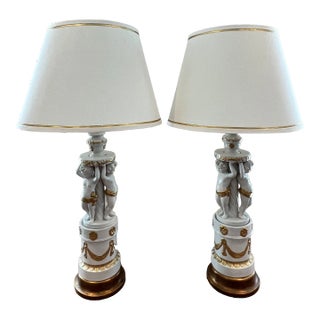 1960s Hollywood Regency Cherub-Themed Table Lamps in White Porcelain Hand-Painted With Gold + Linen Shades - a Pair For Sale