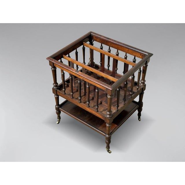 A fine late 19th-century antique French rosewood Canterbury or magazine rack. This Canterbury features three open...