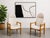 Pair of Mid Century Modern lounge chairs featuring sculptural solid oak frames and newly upholstered in a neutral white...
